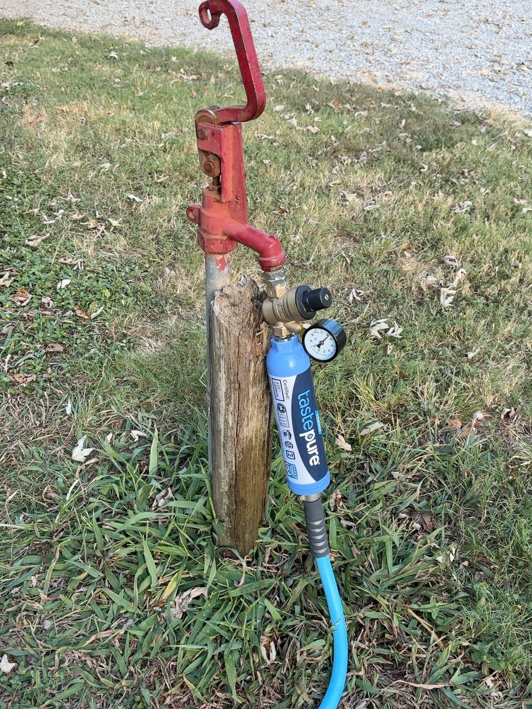 Campground water spigot with regulator, gauge, inline filter, and blue fresh-water hose