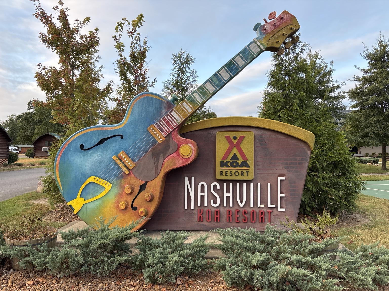 Nashville KOA Resort entrance sign with a large guitar