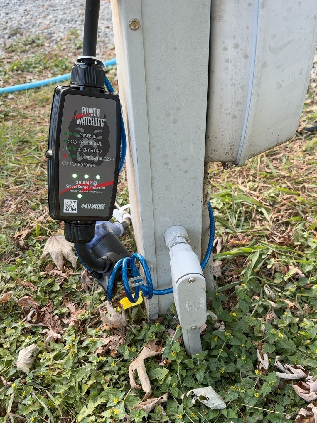 30-amp Power Watchdog connected at an RV campsite electrical pedestal